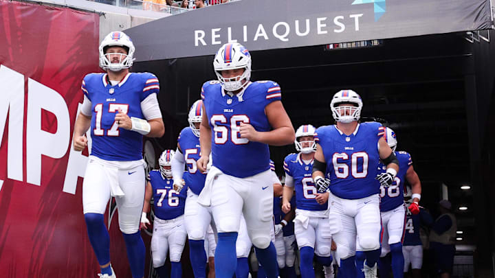 Buffalo Bills quarterback Josh Allen (17) leads the team onto the field for warm ups before a game against the Tampa Bay Buccaneers