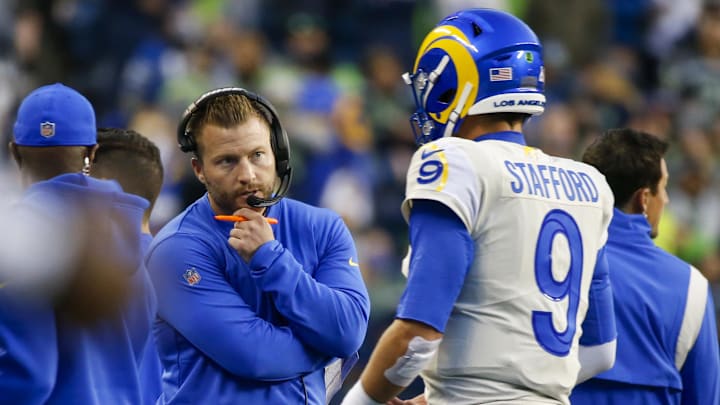 Oct 7, 2021; Seattle, Washington, USA; Los Angeles Rams head coach Sean McVay talks with quarterback Matthew Stafford (9) following a second quarter series against the Seattle Seahawks at Lumen Field. Mandatory Credit: Joe Nicholson-Imagn Images Oct 7, 2021; Seattle, Washington, USA; Los Angeles Rams head coach Sean McVay talks with quarterback Matthew Stafford (9) following a second quarter series against the Seattle Seahawks at Lumen Field. Mandatory Credit: Joe Nicholson-Imagn Images