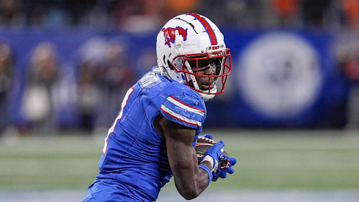 Dec 7, 2024; Charlotte, NC, USA; Southern Methodist Mustangs running back Brashard Smith (1) runs during the fourth quarter against the Clemson Tigers in the 2024 ACC Championship game at Bank of America Stadium. Mandatory Credit: Jim Dedmon-Imagn Images Dec 7, 2024; Charlotte, NC, USA; Southern Methodist Mustangs running back Brashard Smith (1) runs during the fourth quarter against the Clemson Tigers in the 2024 ACC Championship game at Bank of America Stadium. Mandatory Credit: Jim Dedmon-Imagn Images