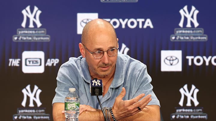 Aug 23, 2023; Bronx, New York, USA; New York Yankees general manager Brian Cashman talks with the media before the game between the Yankees and the Washington Nationals at Yankee Stadium. Mandatory Credit: Vincent Carchietta-Imagn Images