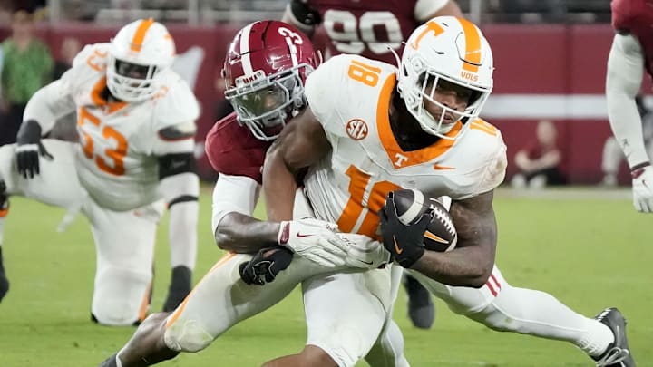 Oct 18, 2025; Tuscaloosa, Alabama, USA; Tennessee Volunteers running back DeSean Bishop (18) is tackled by Alabama Crimson Tide wide receiver Jaylen Mbakwe (3) in the second half at Saban Field at Bryant-Denny Stadium. Mandatory Credit: Gary Cosby-USA TODAY Network via Imagn Images Oct 18, 2025; Tuscaloosa, Alabama, USA; Tennessee Volunteers running back DeSean Bishop (18) is tackled by Alabama Crimson Tide wide receiver Jaylen Mbakwe (3) in the second half at Saban Field at Bryant-Denny Stadium. Mandatory Credit: Gary Cosby-USA TODAY Network via Imagn Images