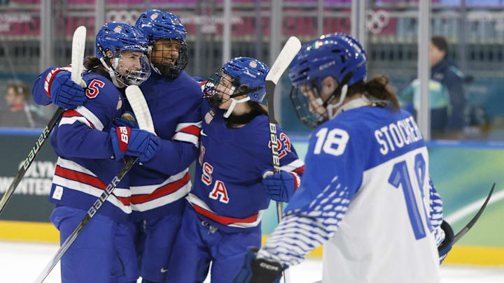 [US, Mexico & Canada customers only] Feb 13, 2026; Milan, Italy;  Megan Keller of United States celebrates with teammates after scoring their first goal against Italy in a women's ice hockey quarterfinal during the Milano Cortina 2026 Olympic Winter Games at Milano Rho Ice Hockey Arena. Mandatory Credit: David W Cerny/Reuters via Imagn Images