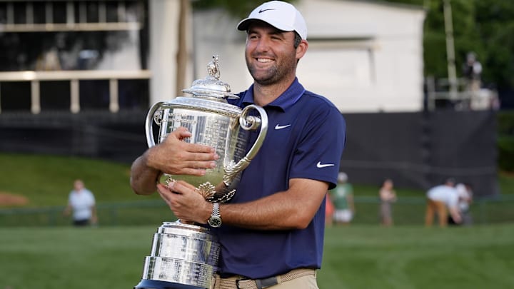 May 18, 2025; Charlotte, North Carolina, USA; Scottie Scheffler holds the Wanamaker Trophy after winning the PGA Championship golf tournament at Quail Hollow. Mandatory Credit: Jim Dedmon-Imagn Images