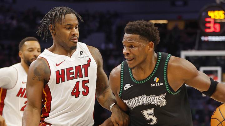 Jan 6, 2026; Minneapolis, Minnesota, USA; Minnesota Timberwolves guard Anthony Edwards (5) works around Miami Heat guard Davion Mitchell (45) in the first quarter at Target Center. Mandatory Credit: Bruce Kluckhohn-Imagn Images