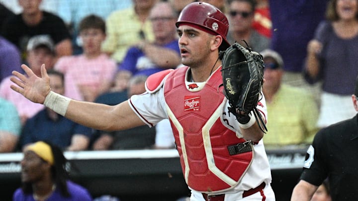 LSU Tigers shortstop Steven Milam (4) scores as Arkansas Razorbacks catcher Ryder Helfrick (27) holds the throw during the eighth inning at Charles Schwab Field. LSU Tigers shortstop Steven Milam (4) scores as Arkansas Razorbacks catcher Ryder Helfrick (27) holds the throw during the eighth inning at Charles Schwab Field.