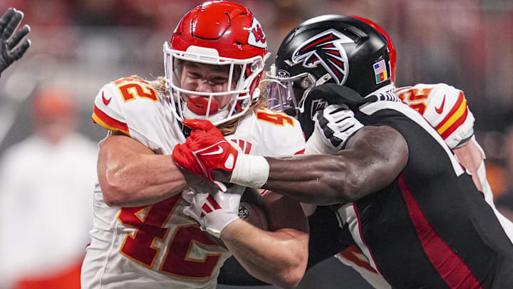 Sep 22, 2024; Atlanta, Georgia, USA; Kansas City Chiefs running back Carson Steele (42) is tackled by Atlanta Falcons linebacker Arnold Ebiketie (17) during the second half at Mercedes-Benz Stadium. Mandatory Credit: Dale Zanine-Imagn Images