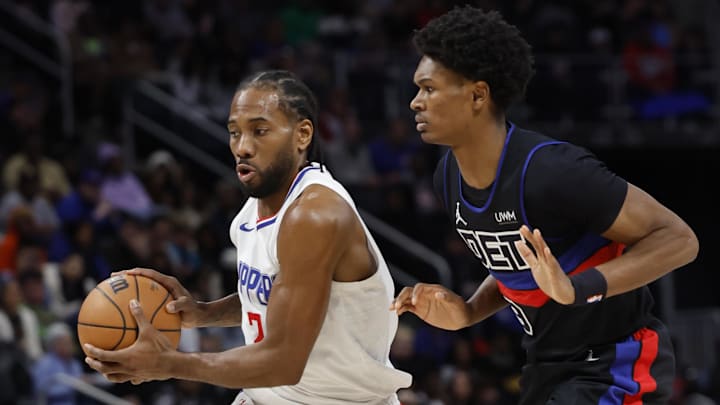 Feb 2, 2024; Detroit, Michigan, USA;  LA Clippers forward Kawhi Leonard (2) dribbles defended by Detroit Pistons forward Ausar Thompson (9) in the first half at Little Caesars Arena. Mandatory Credit: Rick Osentoski-Imagn Images