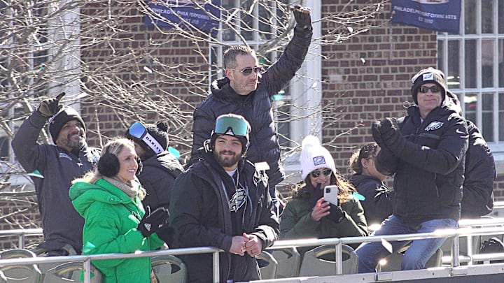 Eagles General Manager Howie Roseman (center) holds a cigar high in the air during the team's Super Bowl championship parade on Friday February 14, 2025.