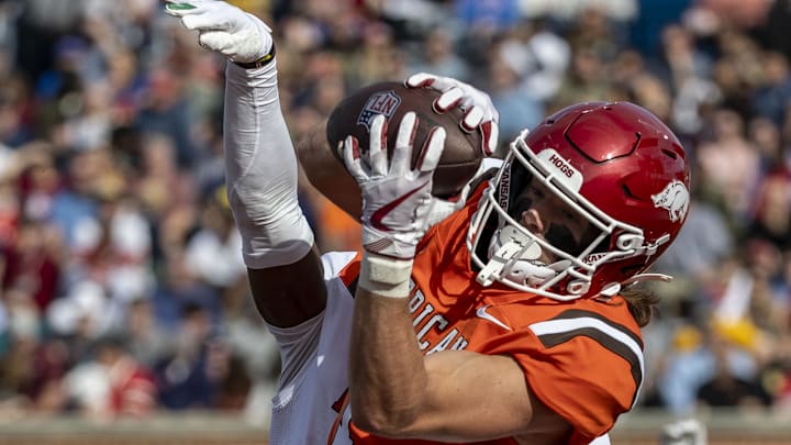 Wide receiver Isaac TeSlaa of Arkansas makes a two-point catch with defense from Johnathan Edwards of Tulane (11) at the Senior Bowl.