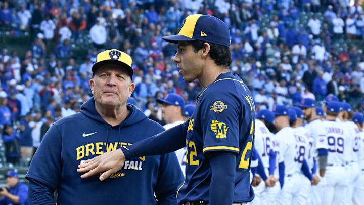 Oct 8, 2025; Chicago, Illinois, USA; Milwaukee Brewers designated hitter Christian Yelich (22) greets manager Pat Murphy (49) prior to game three of the NLDS round against the Chicago Cubs for the 2025 MLB playoffs at Wrigley Field. Mandatory Credit: Matt Marton-Imagn Images
