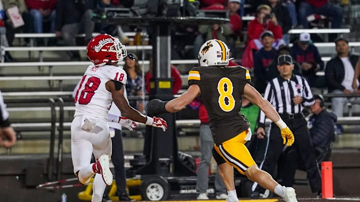 Oct 7, 2023; Laramie, Wyoming, USA; Fresno State Bulldogs wide receiver Jalen Moss (18) scores a touchdown against the Wyoming Cowboys during the second quarter at Jonah Field at War Memorial Stadium. Mandatory Credit: Troy Babbitt-Imagn Images