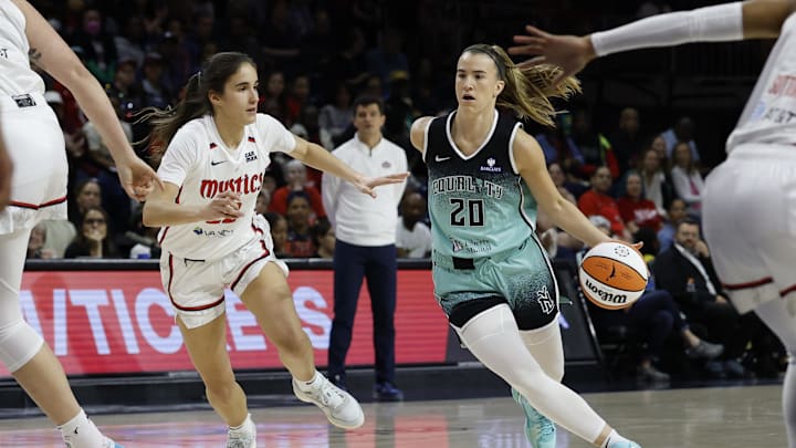 May 30, 2025; Washington, District of Columbia, USA; New York Liberty guard Sabrina Ionescu (20) drives to the basket as Washington Mystics guard Sonia Citron (22) defends in the first half at CareFirst Arena. Mandatory Credit: Geoff Burke-Imagn Images