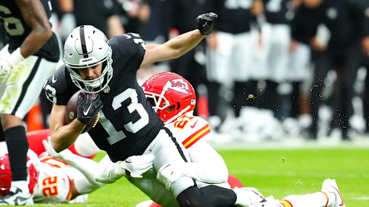 Nov 26, 2023; Paradise, Nevada, USA; Kansas City Chiefs safety Mike Edwards (21) tackles Las Vegas Raiders wide receiver Hunter Renfrow (13) during the third quarter at Allegiant Stadium. Mandatory Credit: Stephen R. Sylvanie-Imagn Images Nov 26, 2023; Paradise, Nevada, USA; Kansas City Chiefs safety Mike Edwards (21) tackles Las Vegas Raiders wide receiver Hunter Renfrow (13) during the third quarter at Allegiant Stadium. Mandatory Credit: Stephen R. Sylvanie-Imagn Images