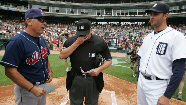 Detroit Tigers' Armando Galarraga and Cleveland Indians bench coach Tim Tolman hand the lineups to tearful home plate umpire Jim Joyce, prior to the start of the game Thursday, June 3, 2010 at Comerica Park. Joyce's blown call the night before cost Galarraga a perfect game.