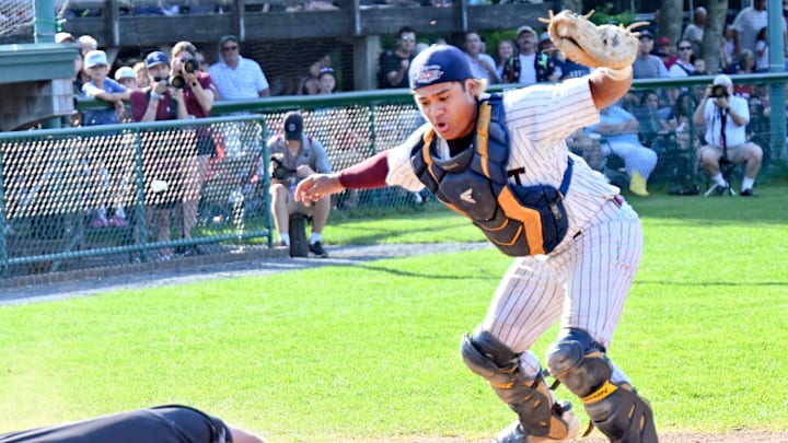 COTUIT 07/05/23 Cotuit catcher Caleb Lomavita reacts after tagging Nate Humphreys of Falmouth as he dives into home. COTUIT 07/05/23 Cotuit catcher Caleb Lomavita reacts after tagging Nate Humphreys of Falmouth as he dives into home.