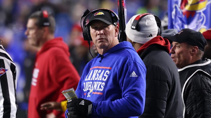 Nov 16, 2024; Provo, Utah, USA; Kansas Jayhawks head coach Lance Leipold checks the scoreboard against the Brigham Young Cougars during the second quarter at LaVell Edwards Stadium. Mandatory Credit: Rob Gray-Imagn Images