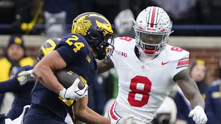 Ohio State Buckeyes linebacker Arvell Reese (8) pursues Michigan Wolverines running back Bryson Kuzdzal (24) during the NCAA football game at Michigan Stadium in Ann Arbor, Mich. on Nov. 29, 2025. Ohio State won 27-9.