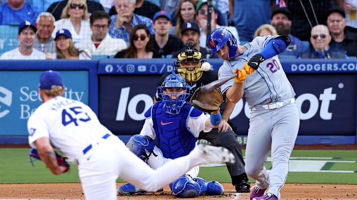 Oct 20, 2024; Los Angeles, California, USA; New York Mets first base Pete Alonso (20) hits and reaches first base on an error during the first inning against the Los Angeles Dodgers during game six of the NLCS for the 2024 MLB playoffs at Dodger Stadium. Mandatory Credit: Jason Parkhurst-Imagn Images
