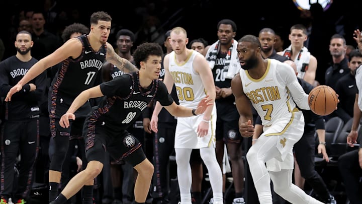 Jan 23, 2026; Brooklyn, New York, USA; Boston Celtics guard Jaylen Brown (7) looks to pass the ball against Brooklyn Nets guard Nolan Traore (88) during double overtime at Barclays Center. Mandatory Credit: Brad Penner-Imagn Images