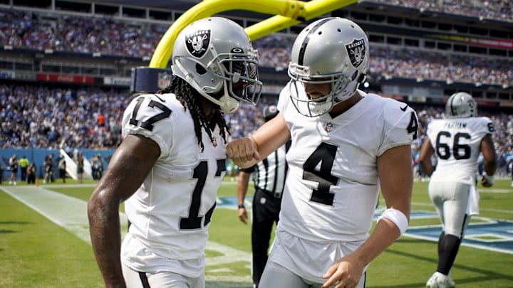 Sep 25, 2022; Nashville, Tennessee, USA; Las Vegas Raiders wide receiver Davante Adams (17) celebrates his touchdown against the Tennessee Titans with quarterback Derek Carr (4) during the second quarter at Nissan Stadium. Mandatory Credit: Andrew Nelles-Imagn Images Sep 25, 2022; Nashville, Tennessee, USA; Las Vegas Raiders wide receiver Davante Adams (17) celebrates his touchdown against the Tennessee Titans with quarterback Derek Carr (4) during the second quarter at Nissan Stadium. Mandatory Credit: Andrew Nelles-Imagn Images