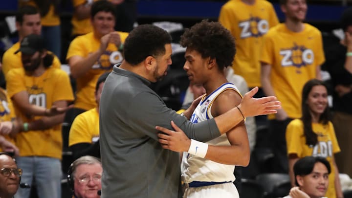 Dec 11, 2024; Pittsburgh, Pennsylvania, USA;  Pittsburgh Panthers head coach Jeff Capel (left) embraces guard Brandin Cummings (3) against the Eastern Kentucky Colonels during the second half at the Petersen Events Center. Mandatory Credit: Charles LeClaire-Imagn Images