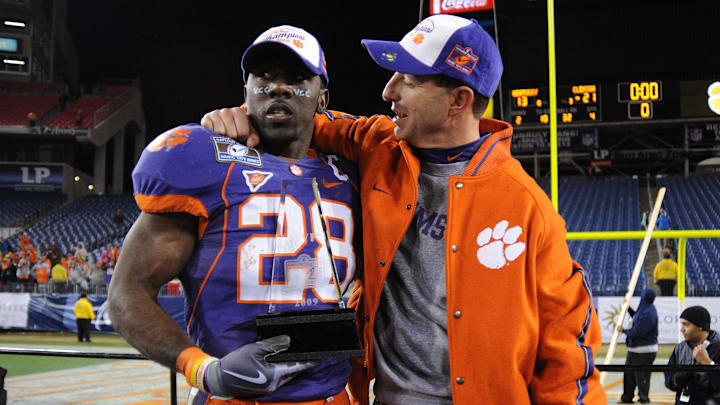 Dec 27, 2009; Nashville, TN, USA; Clemson Tigers head coach stands with running back CJ Spiller (28) as Spiller holds the Music City Bowl MVP award after defeating the Kentucky Wildcats in the 2009 Music City Bowl at LP Field. The Tigers beat the Wildcats 21-13. Mandatory Credit: Don McPeak-USA TODAY Sports