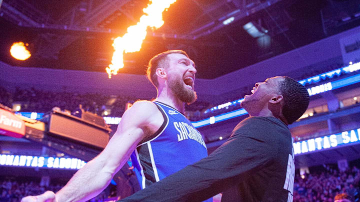 Jan 19, 2025; Sacramento, California, USA; Sacramento Kings forward Domantas Sabonis (11) and guard De'Aaron Fox (5) celebrate during pregame introductions before the game against the Washington Wizards at Golden 1 Center. Mandatory Credit: Ed Szczepanski-Imagn Images