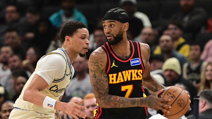 Mar 4, 2026; Milwaukee, Wisconsin, USA; Atlanta Hawks guard Nickeil Alexander-Walker (7) looks for a shot against Milwaukee Bucks guard Ryan Rollins (13) in the second quarter at Fiserv Forum. Mandatory Credit: Benny Sieu-Imagn Images