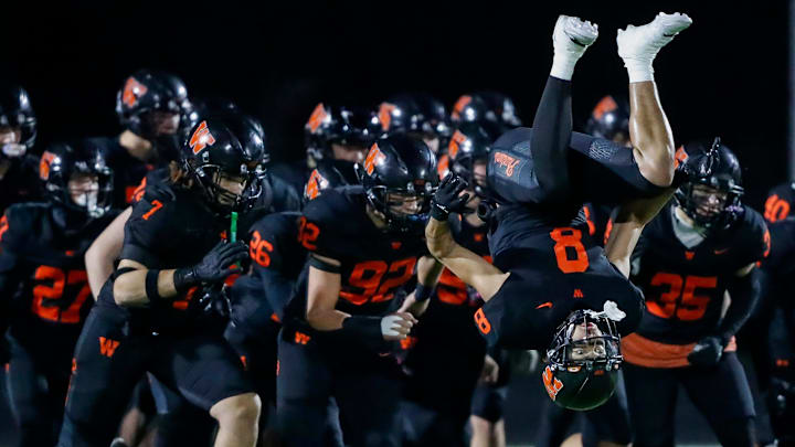 West De Pere High School's Judeah Kniskern (8) does a backflip as the Phantoms are introduced as a team before a WIAA Division 2 state semifinal against Rice Lake High School on Friday, November 15, 2024, at Marshfield High School in Marshfield, Wis. Rice Lake won the game, 31-24, after forcing a West De Pere turnover on downs inside the five-yard line in the final minute of the game West De Pere High School's Judeah Kniskern (8) does a backflip as the Phantoms are introduced as a team before a WIAA Division 2 state semifinal against Rice Lake High School on Friday, November 15, 2024, at Marshfield High School in Marshfield, Wis. Rice Lake won the game, 31-24, after forcing a West De Pere turnover on downs inside the five-yard line in the final minute of the game