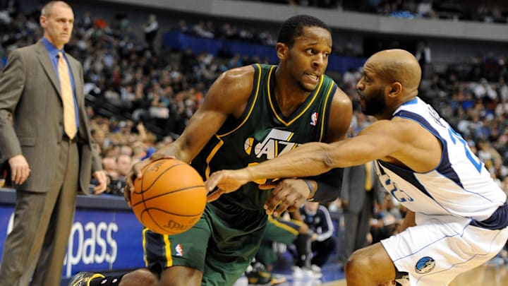 Jan 27, 2012; Dallas, TX, USA; Dallas Mavericks shooting guard Vince Carter (25) reaches in to knock the ball away from Utah Jazz small forward C.J. Miles (34) during the second quarter at the American Airlines Center. Mandatory Credit: Jerome Miron-Imagn Images