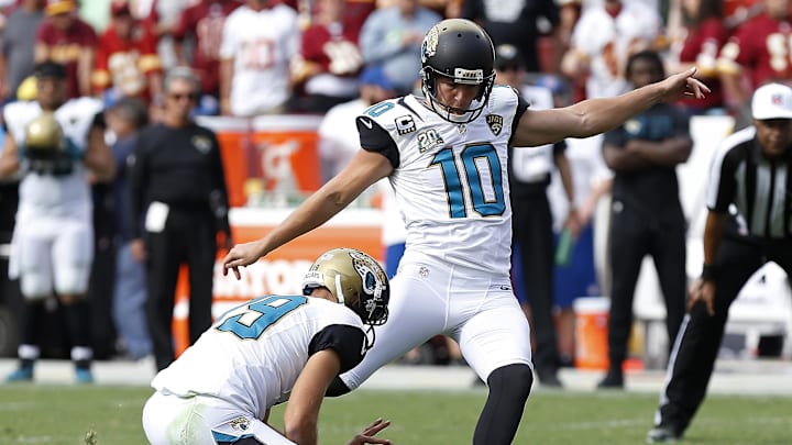 Sep 14, 2014; Landover, MD, USA; Jacksonville Jaguars kicker Josh Scobee (10) attempts a field goal against the Washington Redskins at FedEx Field. Mandatory Credit: Geoff Burke-Imagn Images