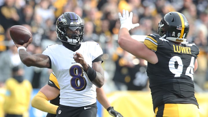 Nov 17, 2024; Pittsburgh, Pennsylvania, USA; Baltimore Ravens quarterback Lamar Jackson (8) passes against pressure from Pittsburgh Steelers defensive tackle Dean Lowry (94) during the first quarter at Acrisure Stadium. Mandatory Credit: Charles LeClaire-Imagn Images Nov 17, 2024; Pittsburgh, Pennsylvania, USA; Baltimore Ravens quarterback Lamar Jackson (8) passes against pressure from Pittsburgh Steelers defensive tackle Dean Lowry (94) during the first quarter at Acrisure Stadium. Mandatory Credit: Charles LeClaire-Imagn Images