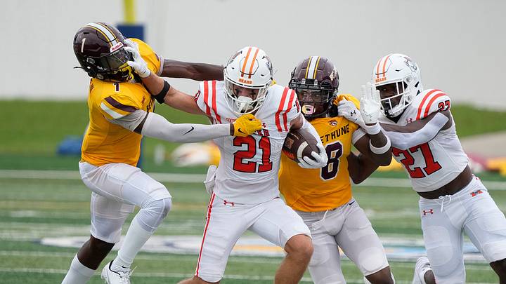 Bethune-Cookman's Raymond Woodie III (1) attempts to chase down Mercer's Brayden Smith (21) during a game at Daytona Stadium in Daytona Beach, Saturday, Sept. 7, 2024.