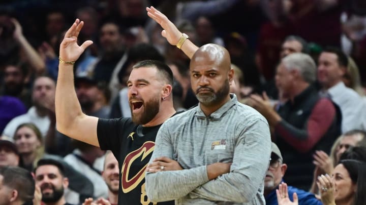 Mar 5, 2024; Cleveland, Ohio, USA; Kansas City Chiefs tight end and Cleveland native Travis Kelce, left, cheers as Cleveland Cavaliers head coach J.B. Bickerstaff looks on during the second half against the Boston Celtics at Rocket Mortgage FieldHouse. Mandatory Credit: Ken Blaze-USA TODAY Sports Mar 5, 2024; Cleveland, Ohio, USA; Kansas City Chiefs tight end and Cleveland native Travis Kelce, left, cheers as Cleveland Cavaliers head coach J.B. Bickerstaff looks on during the second half against the Boston Celtics at Rocket Mortgage FieldHouse. Mandatory Credit: Ken Blaze-USA TODAY Sports