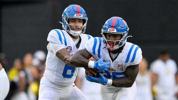 Mississippi Rebels quarterback Trinidad Chambliss hands the ball off to running back Makhi Frazier. Mandatory Credit: Steve Roberts-Imagn Images