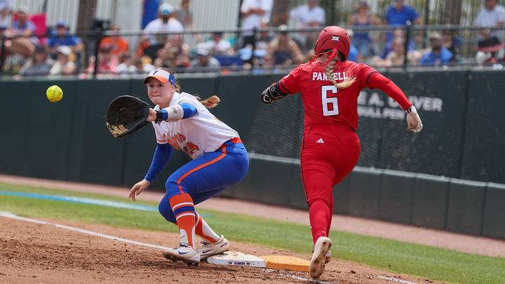 Florida infielder Madison Walker (24) gets Texas Tech third baseman Taylor Pannell (6) out during the super regional game of the NCAA Division 1 softball championship at Katie Seashole Pressly Stadium in Gainesville, FL on Friday, May 22, 2026. [Alan Youngblood/Gainesville Sun]