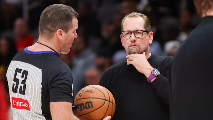 Oct 14, 2024; Atlanta, Georgia, USA; Philadelphia 76ers head coach Nick Nurse talks to referee Matt Kallio (53) against the Atlanta Hawks in the third quarter at State Farm Arena. Mandatory Credit: Brett Davis-Imagn Images