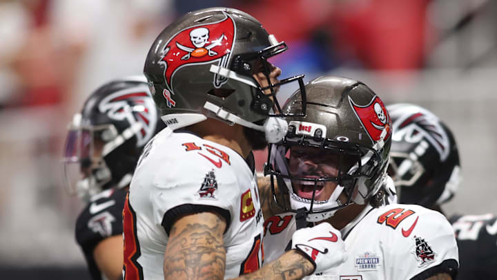 Tampa Bay Buccaneers wide receiver Mike Evans (13) celebrates with wide receiver Emeka Egbuka (2) after a touchdown against the Atlanta Falcons