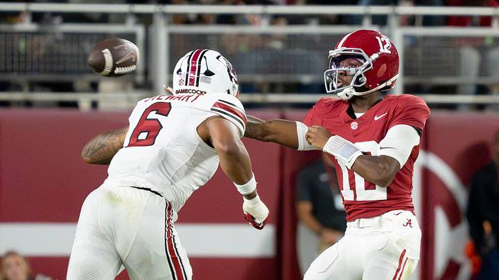 Sep 26, 2026; Tuscaloosa, AL, USA;  Alabama quarterback Keelon Russell (12) makes a sidearm throw around South Carolina edge rusher Dylan Stewart (6) at Saban Field at Bryant Denny Stadium. Mandatory Credit: Gary Cosby Jr.-Tuscaloosa News