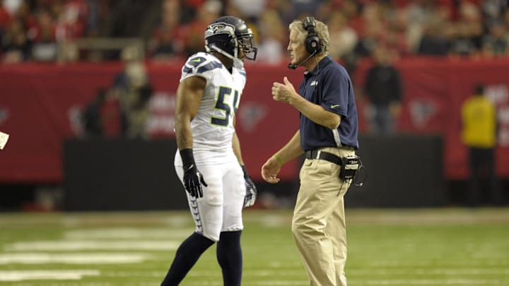 Jan 13, 2013; Atlanta, GA, USA; Seattle Seahawks head coach Pete Carroll talks to middle linebacker Bobby Wagner (54) during the second quarter of the NFC divisional playoff game at the Georgia Dome. Mandatory Credit: Dale Zanine-Imagn Images