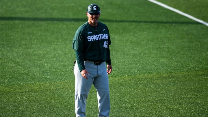 Michigan State coach watches during a NCAA Big Ten Conference baseball game against Iowa, Friday, Michigan State coach watches during a NCAA Big Ten Conference baseball game against Iowa, Friday,