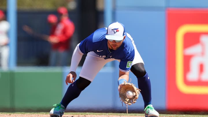 Toronto Blue Jays shortstop Bo Bichette (11) fields the ball for an out against the Philadelphia Phillies in the fifth inning during spring training at TD Ballpark on March 21.