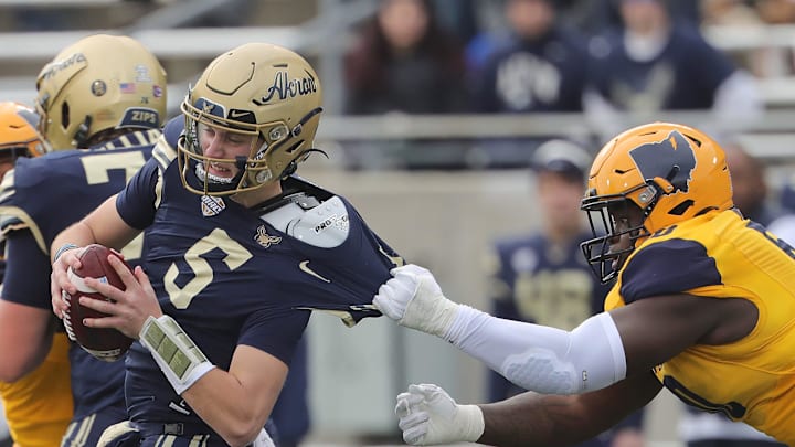 Kent State defensive tackle CJ West sacks Akron quarterback Zach Gibson during the second quarter on