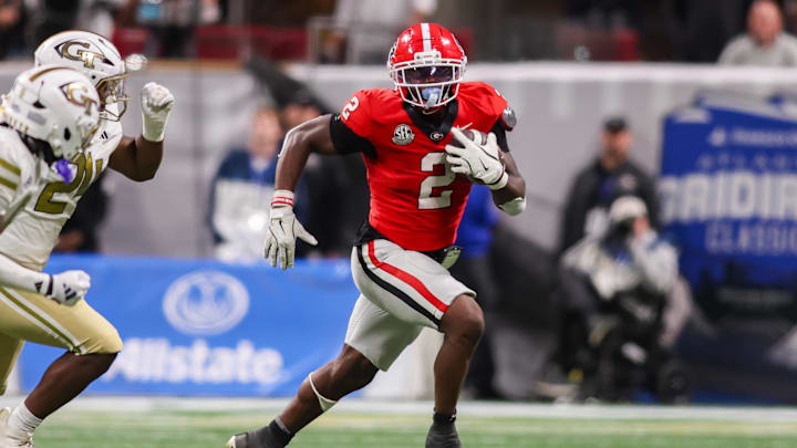 Nov 28, 2025; Atlanta, Georgia, USA; Georgia Bulldogs running back Josh McCray (2) runs the ball against the Georgia Tech Yellow Jackets in the fourth quarter at Mercedes-Benz Stadium. Mandatory Credit: Brett Davis-Imagn Images
