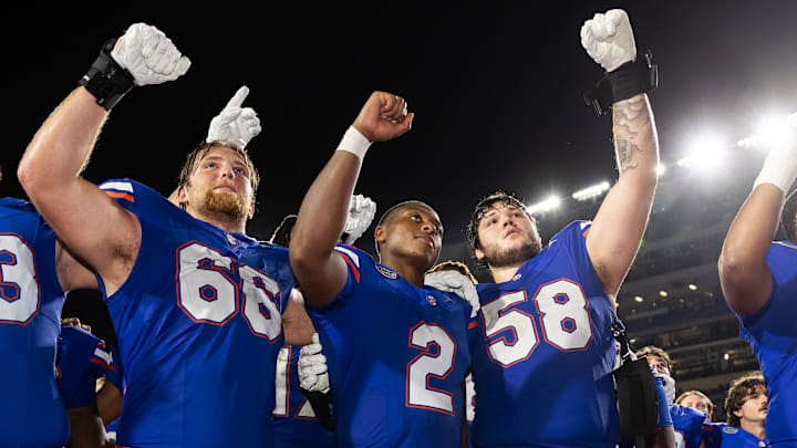 Sep 7, 2024; Gainesville, Florida, USA; Florida Gators offensive lineman Jake Slaughter (66), quarterback DJ Lagway (2), and offensive lineman Austin Barber (58) celebrate against the Samford Bulldogs after the game at Ben Hill Griffin Stadium. Mandatory Credit: Matt Pendleton-Imagn Images Sep 7, 2024; Gainesville, Florida, USA; Florida Gators offensive lineman Jake Slaughter (66), quarterback DJ Lagway (2), and offensive lineman Austin Barber (58) celebrate against the Samford Bulldogs after the game at Ben Hill Griffin Stadium. Mandatory Credit: Matt Pendleton-Imagn Images