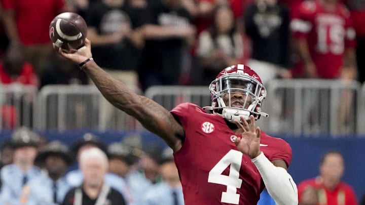 Dec 2, 2023; Atlanta, GA, USA;  Alabama Crimson Tide quarterback Jalen Milroe (4) throws against Georgia at Mercedes-Benz Stadium. Milroe was named the MVP. Alabama defeated Georgia 27-24 to claim the SEC Championship. Mandatory Credit: Gary Cosby Jr.-Imagn Images
