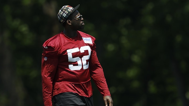 Washington Commanders defensive tackle Javon Kinlaw stands on the field on day one of minicamp