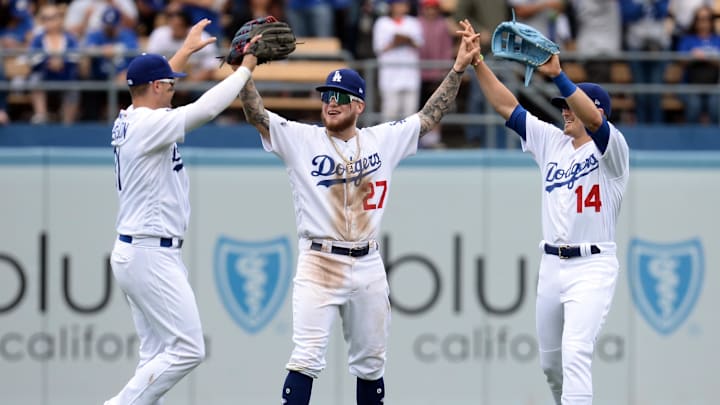 June 2, 2019; Los Angeles, CA, USA; Los Angeles Dodgers left fielder Joc Pederson (31) center fielder Alex Verdugo (27) and right fielder Enrique Hernandez (14) celebrate the 8-0 victory against the Philadelphia Phillies at Dodger Stadium. Mandatory Credit: Gary A. Vasquez-Imagn Images