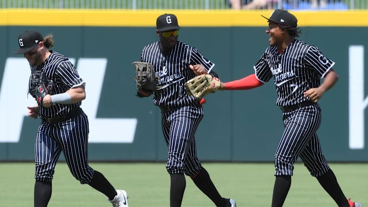 Greenville Drive outfielder Nelly Taylor (1) celebrates with Greenville Drive outfielder Yophery Rodriguez (7) Sunday, Aug. 24, 2025 during the MiLB baseball game against the Hub City Spartanburgers at Fifth Third Park in Spartanburg, South Carolina.