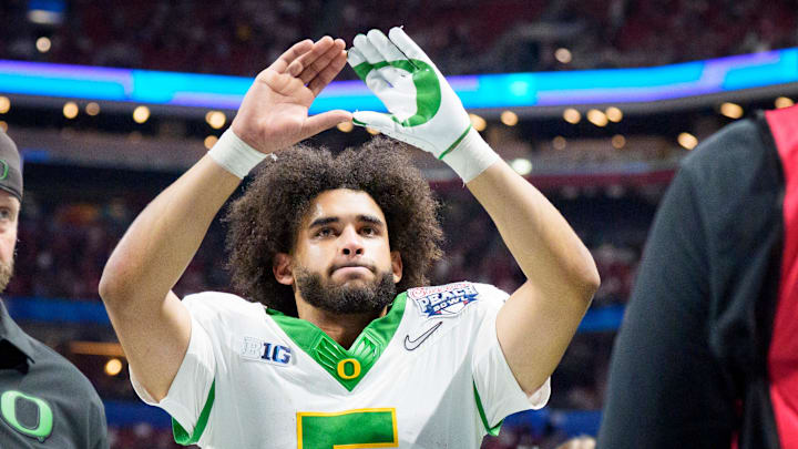 Oregon quarterback Dante Moore walks off the field as the Oregon Ducks face the Indiana Hoosiers in the Peach Bowl on Jan. 9, 2026, at Mercedes-Benz Stadium in Atlanta, Georgia.